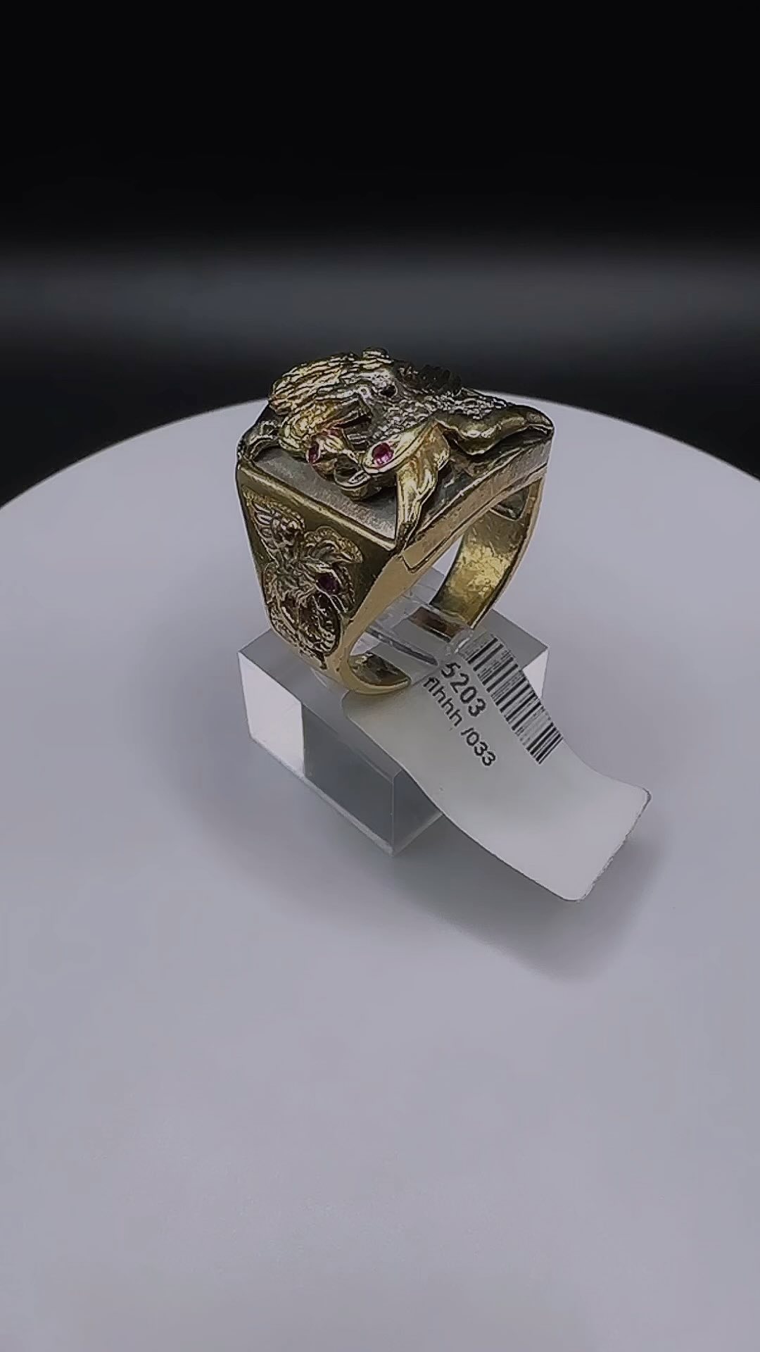 14k yellow gold soild ring! This ring has a custom design with an eagle and a snake on the center face both have Ruby eyes as well as has two more eagles, holding snakes on each side with Ruby eyes as well! This unique fashion statement has quite the bold yet elegant approach. Contact us today for details and information!